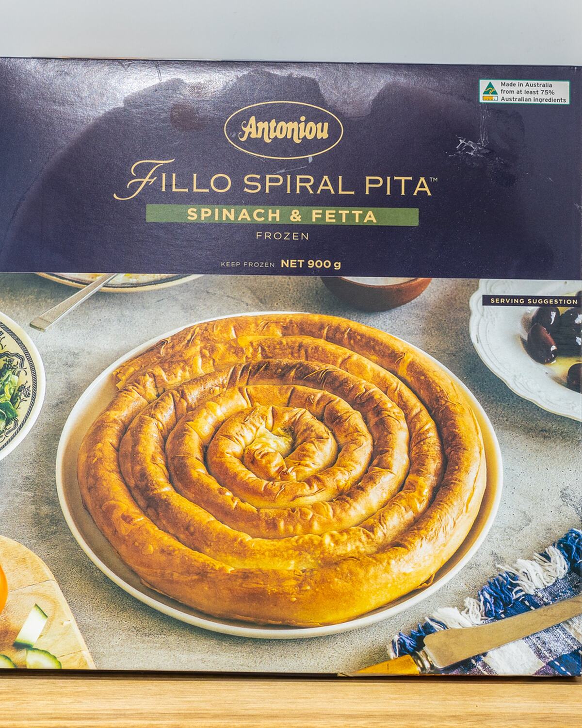 A box of frozen spinach and feta fillo spiral pita, ready to bake at home