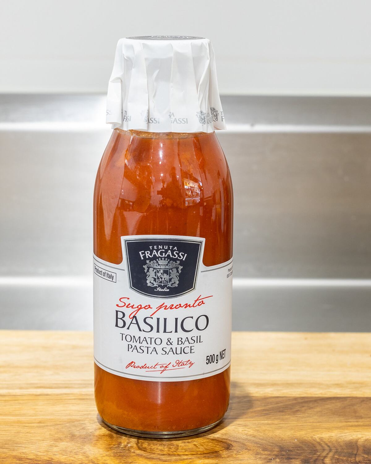 A bottle of Fragassi basilico pasta sauce on the counter at Rose's Deli