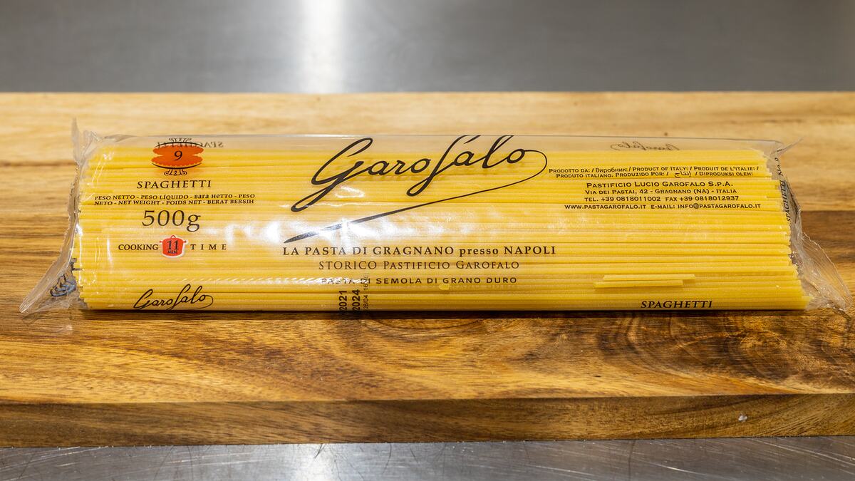 A packet of Garofalo spaghetti from Gragnano on the wooden deli counter